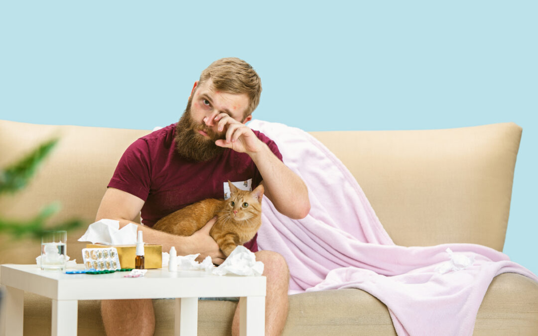 Image of young man suffering from a cat allergy